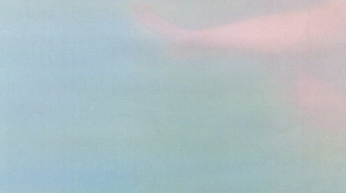 Blurry underwater image of a woman’s legs. The colors are pastel and the image has the quality of a painting.