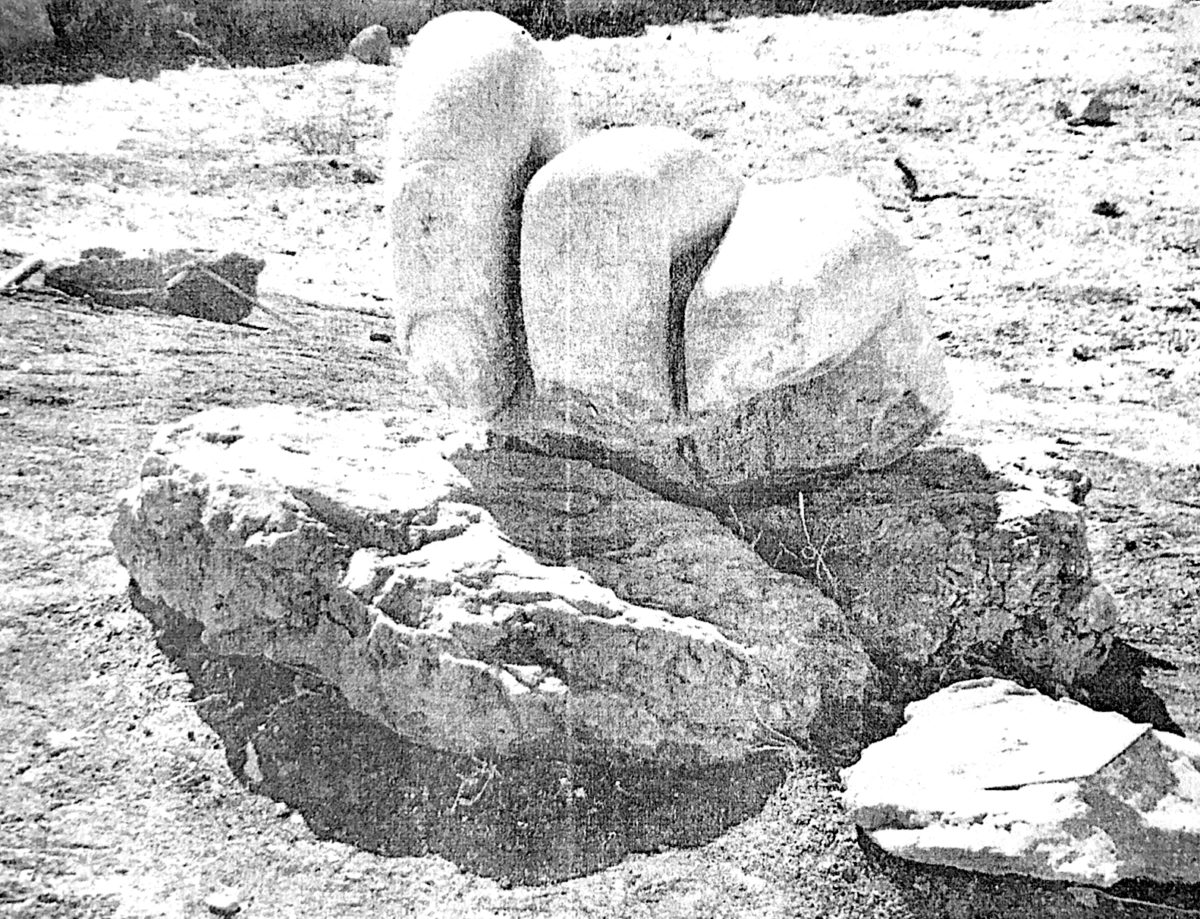 A black and white photocopied image of a large hand made of stone with three fingers in the Temple of Hercules in Amman, Jordan . Only one finger is fully intact.